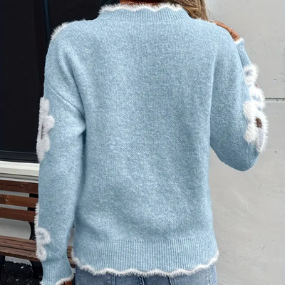 Liva Sweater med blomsterprint – damesweater med V-hals og strikkede detaljer
